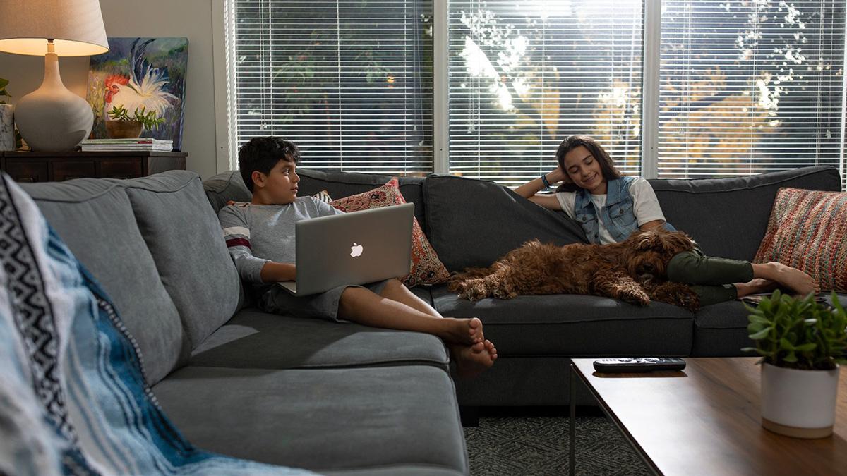 A family sitting on the couch